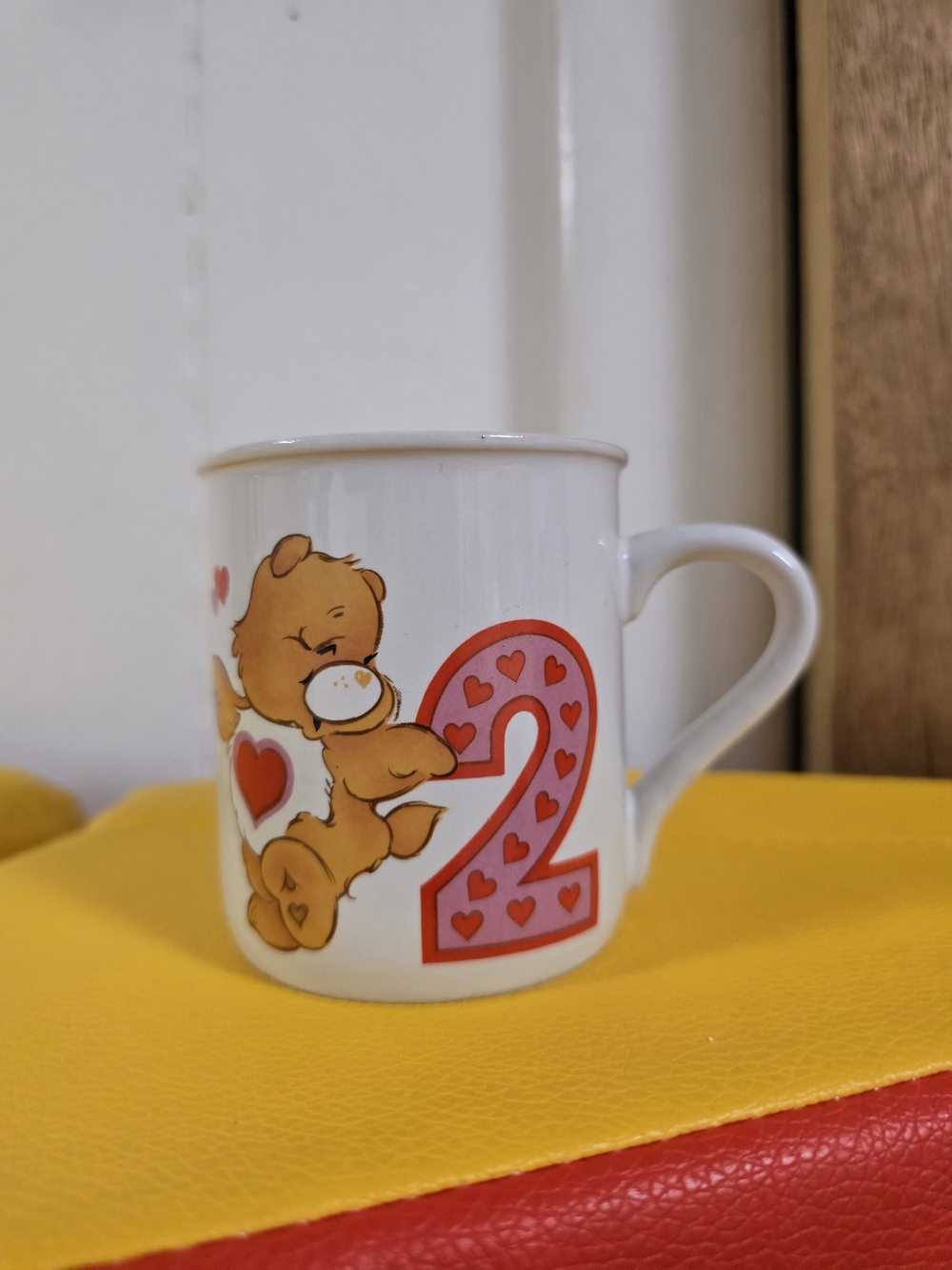 vintage 1985 Care Bears 2nd Birthday child's stoneware mug featuring Tenderheart